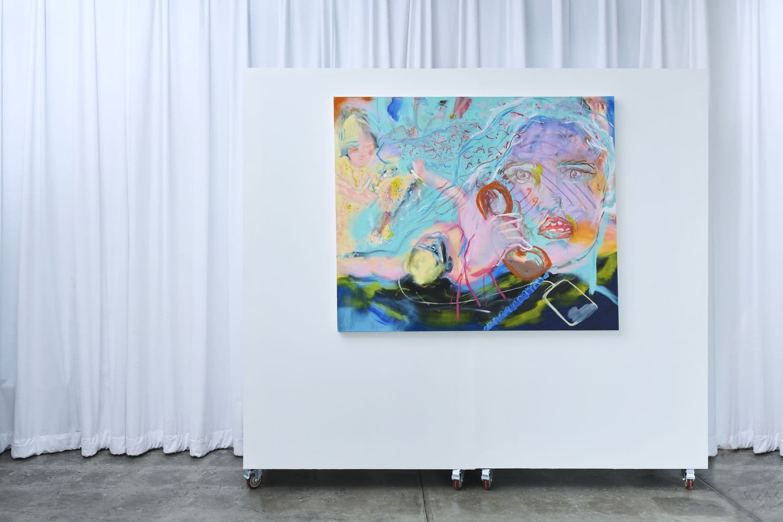 Large painting on a freestanding white gallery wall with sheer curtains behind