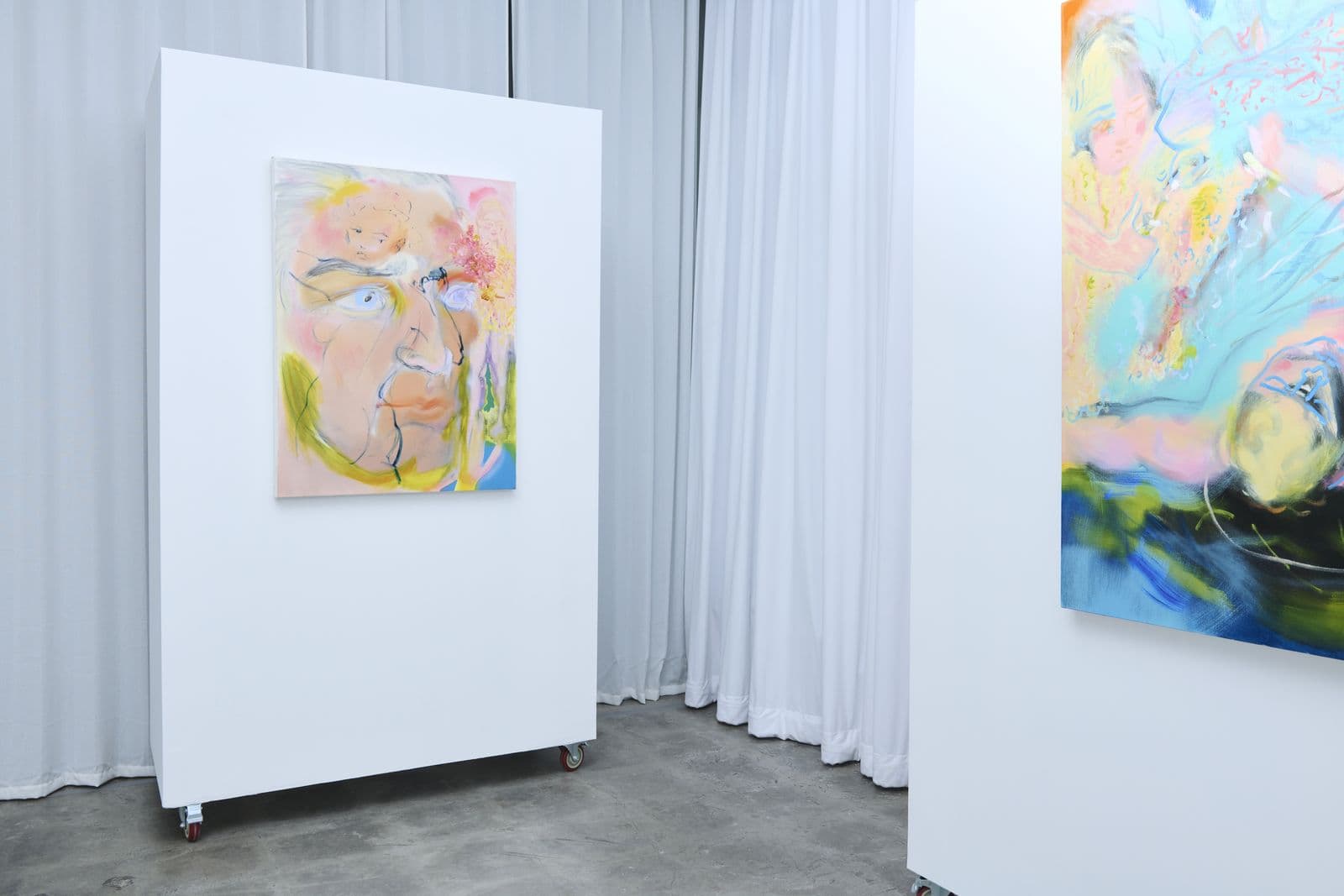 Movable gallery walls and floor-to-ceiling curtains inside Lola Gallery's exhibition space