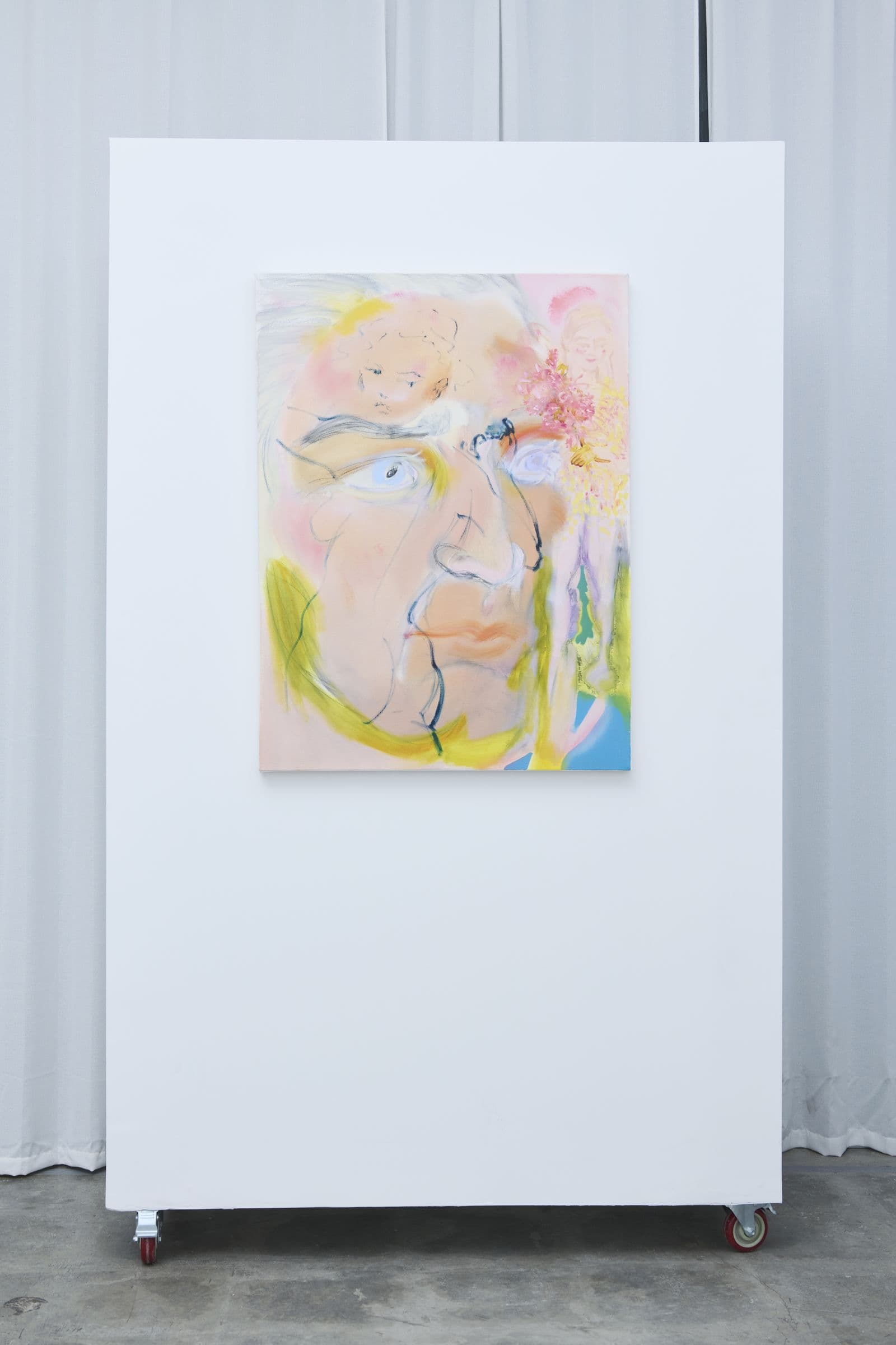 Painting installed on a rolling white wall in Of Living Deliciously at Lola Gallery